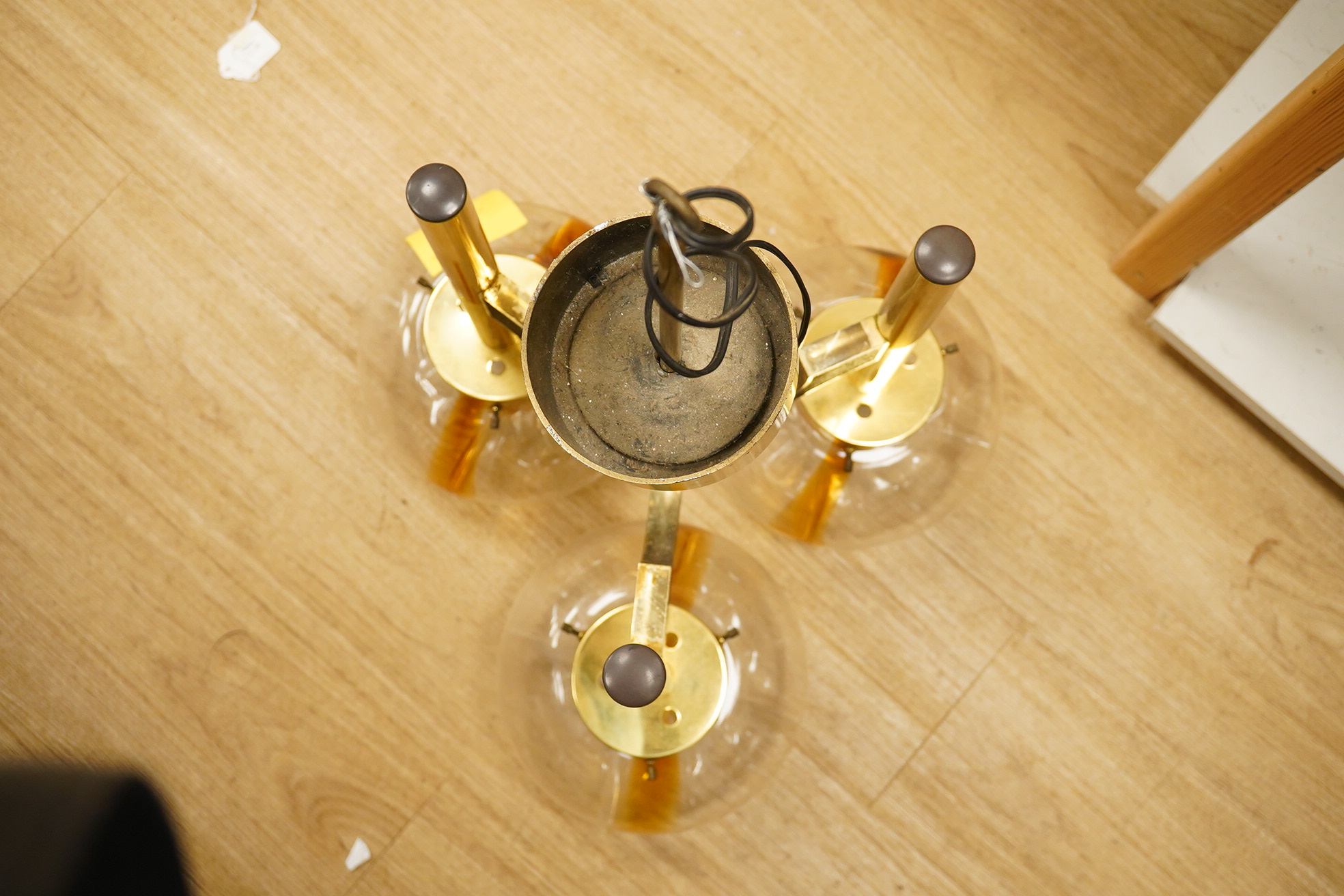 In the manner of Sciolar, a mid century three light brass and glass light fitting, 53cm high. Condition - good